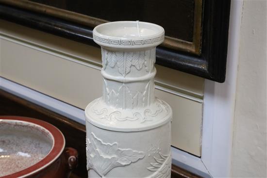 A Chinese white glazed moulded rouleau vase, Wang Bingrong seal mark, H.34.5cm